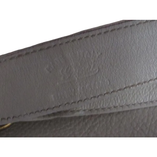 Vintage 1970s Gucci white textured leather Blondie style saddle bag with XL gold GG logo cutout in mint condition