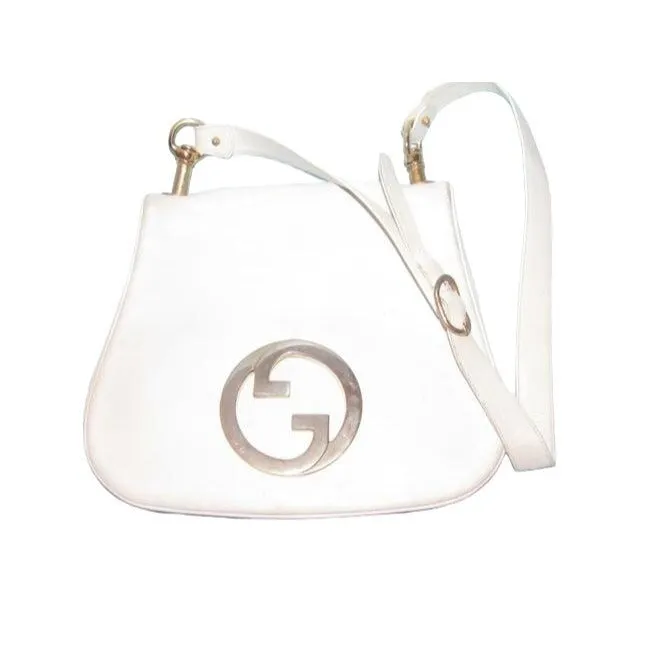 Vintage 1970s Gucci white textured leather Blondie style saddle bag with XL gold GG logo cutout in mint condition