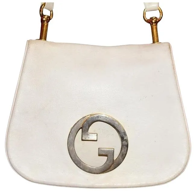 Vintage 1970s Gucci white textured leather Blondie style saddle bag with XL gold GG logo cutout in mint condition