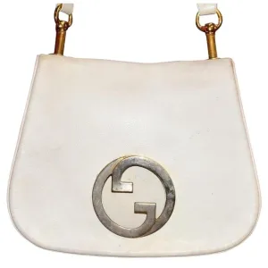 Vintage 1970s Gucci white textured leather Blondie style saddle bag with XL gold GG logo cutout in mint condition